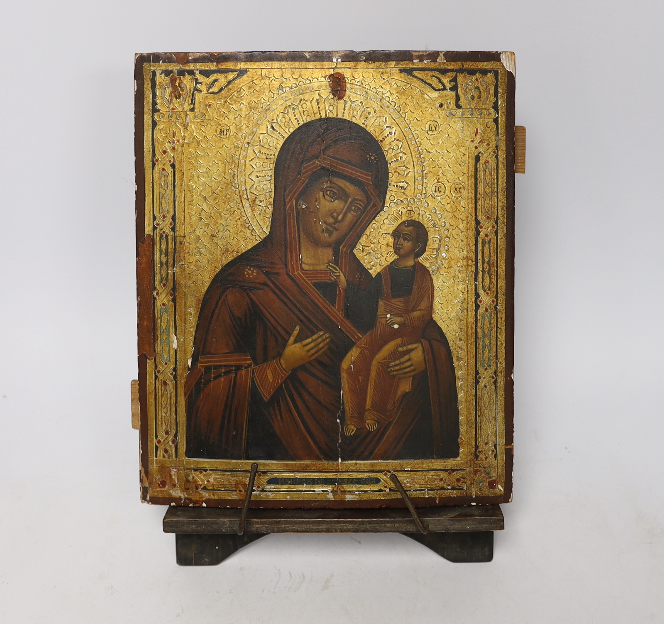 Late 19th century Russian School, hand painted Icon on panel, with stand, 26 x 21cm, unframed